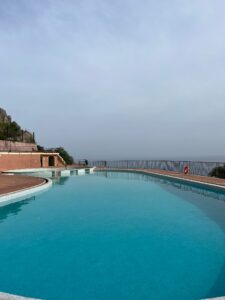 Pool at Capo dei Greci overlooking the scenery of Italy